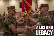 U.S. Marine Corps Col. Scott R. Johnson, passes the regimental colors to Col. Omar J. Randall during a change of command ceremony June 7, 2019, at Camp Kinser, Okinawa, Japan. Johnson, a native of Talkeetna, Alaska, relinquished command of Combat Logistics Regiment 37, 3rd Marine Logistics Group, to Randall, a native of Bronx, New York, during the ceremony. (U.S. Marine Corps photo by Lance Cpl. Terry Wong)