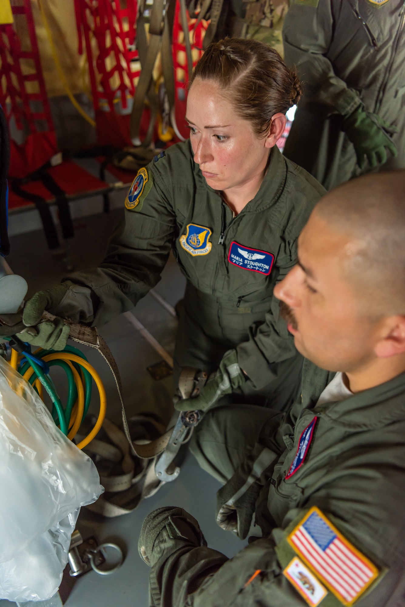 U.S. Air Force Capt. Maria Stoughton, flight nurse assigned to the 18th Aeromedical Evacuation Squadron, secures the neonatal transport system on the KC-135 Stratotanker during a Neonatal Intensive Care Unit transportation course June 5, 2019, on Kadena Air Base, Japan. The NICU transportation course goes over the roles and responsibilities necessary when transporting an infant patient, what to expect, and what is essential to carry out the mission successfully. (U.S. Air Force photo by Airman 1st Class Cynthia Belío)