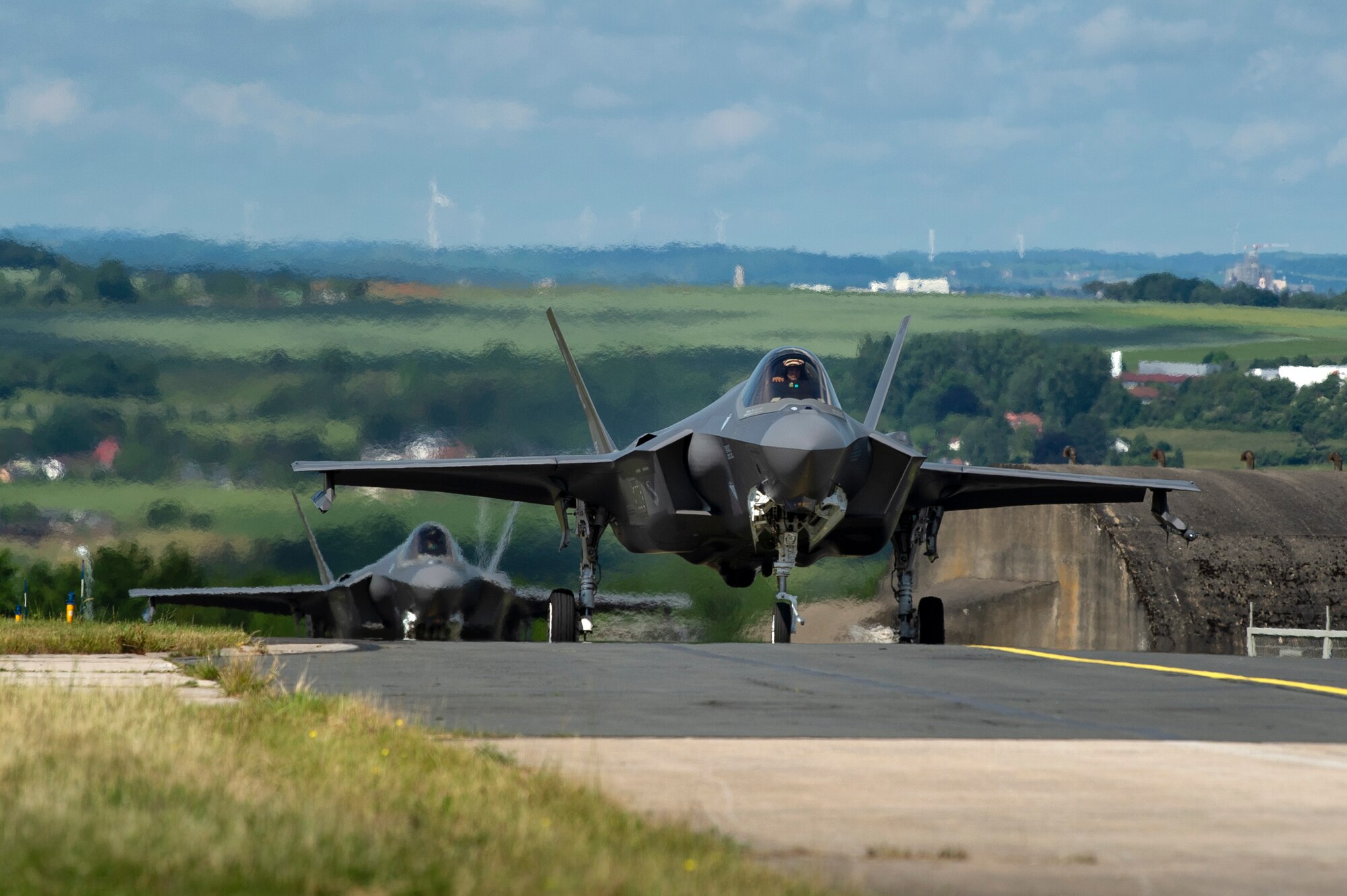 U.S. Air Force F-35A Lightning II fighter aircraft, assigned to the 421st Fighter Squadron, Hill Air Force Base, Utah, taxi on the flightline at Spangdahlem Air Base, Germany, June 11, 2019. Multiple F-35s arrived as part of a Theater Security Package. The aircraft have a unique combination of stealth, speed, and agility, making them some of the best dominance fighters in the world. (U.S. Air Force photo by Airman 1st Class Valerie Seelye)