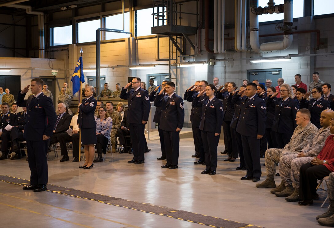 Members of the 423rd Medical Squadron salute their new commander at RAF Alconbury, England, June 11, 2019. The Change of Command ceremony represents the official exchange of leadership. (U.S. Air Force photo by Airman 1st Class Gabrielle Winn)