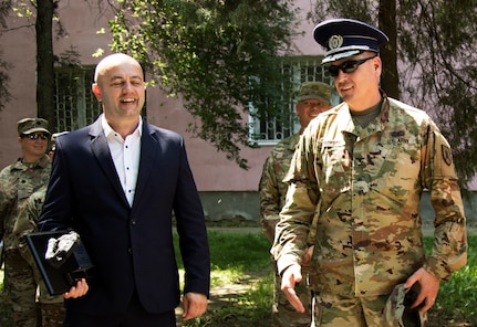 Col. Jon Erickson, the commander of the 141st Maneuver Enhancement Brigade, stationed out of Fargo, North Dakota, and the police chief of Slobozia, Romania, exchange gifts at the end of a key leader meeting. Erickson gave a plaque with a bison on top that represents an important part of North Dakota while the police chief gave him his hat. Saber Guardian 19 is an exercise about bringing allies together, to work alongside of each other in order to maintain relationships based on trust that are essential for ensuring global security.