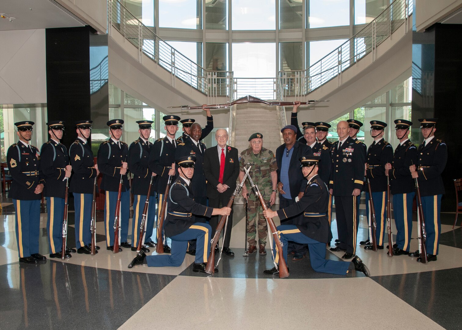 The U.S. Army Drill team poses for a photo with veterans Army Air Corps Master Sgt. Harry Miller (middle, left) and Army Sgt. 1st Class Rafael Lopez (middle, right) during a celebration of the Army’s 244th birthday at the McNamara Headquarters Complex June 11.