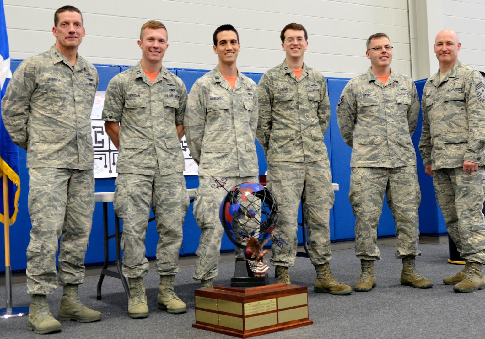 Maj. Gen. Robert Skinner, 24th Air Force commander, and Chief Master Sgt. David Klink, 24th AF command chief, pose for a photo with the 24th AF Cyber Competition unit team winner in San Antonio, June 7, 2019. The team, from the 390th Cyberspace Operations Squadron, included Capts. Paul Jordan, David Musielewicz and Anthony Canino and Tech. Sgt. Zachary Stoll.