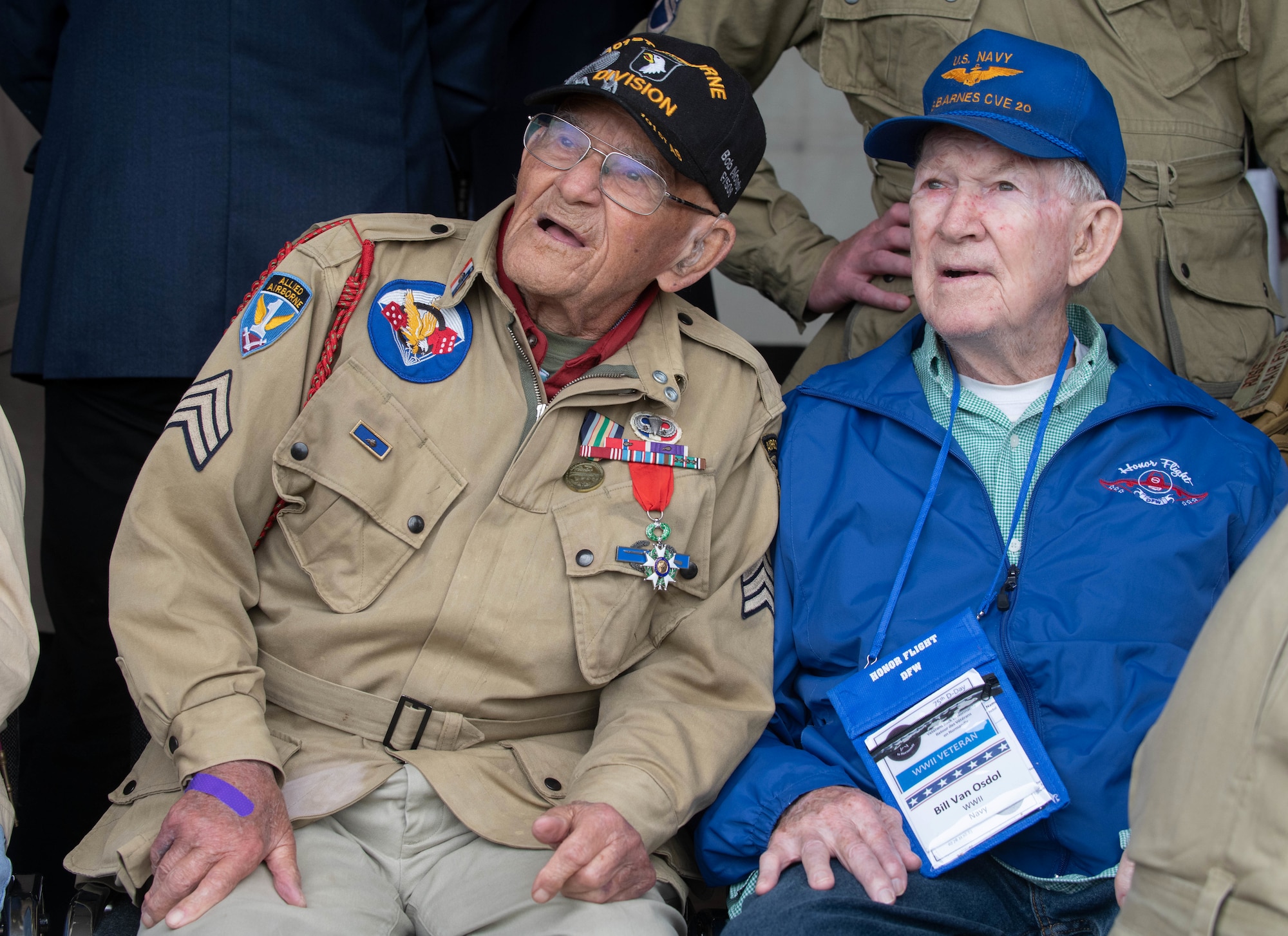 World War II veterans Robert Noody and Bill Van Osdol watch the aerial demonstration at the D-Day 75 Commemorative Airborne Operation in Sainte-Mere-Eglise, France, June 9, 2019, which honors the epic airborne operation conducted by Allied forces on June 6, 1944. This commemorative airborne operation was an opportunity for multinational forces to honor the past and simultaneously work to secure the future. Training together in the very same place that trans-Atlantic resolve began 75 years ago demonstrates the partnerships and bonds that we highly value and continue to benefit from to this day. (U.S. Air Force photo by Airman 1st Class Jennifer Zima)