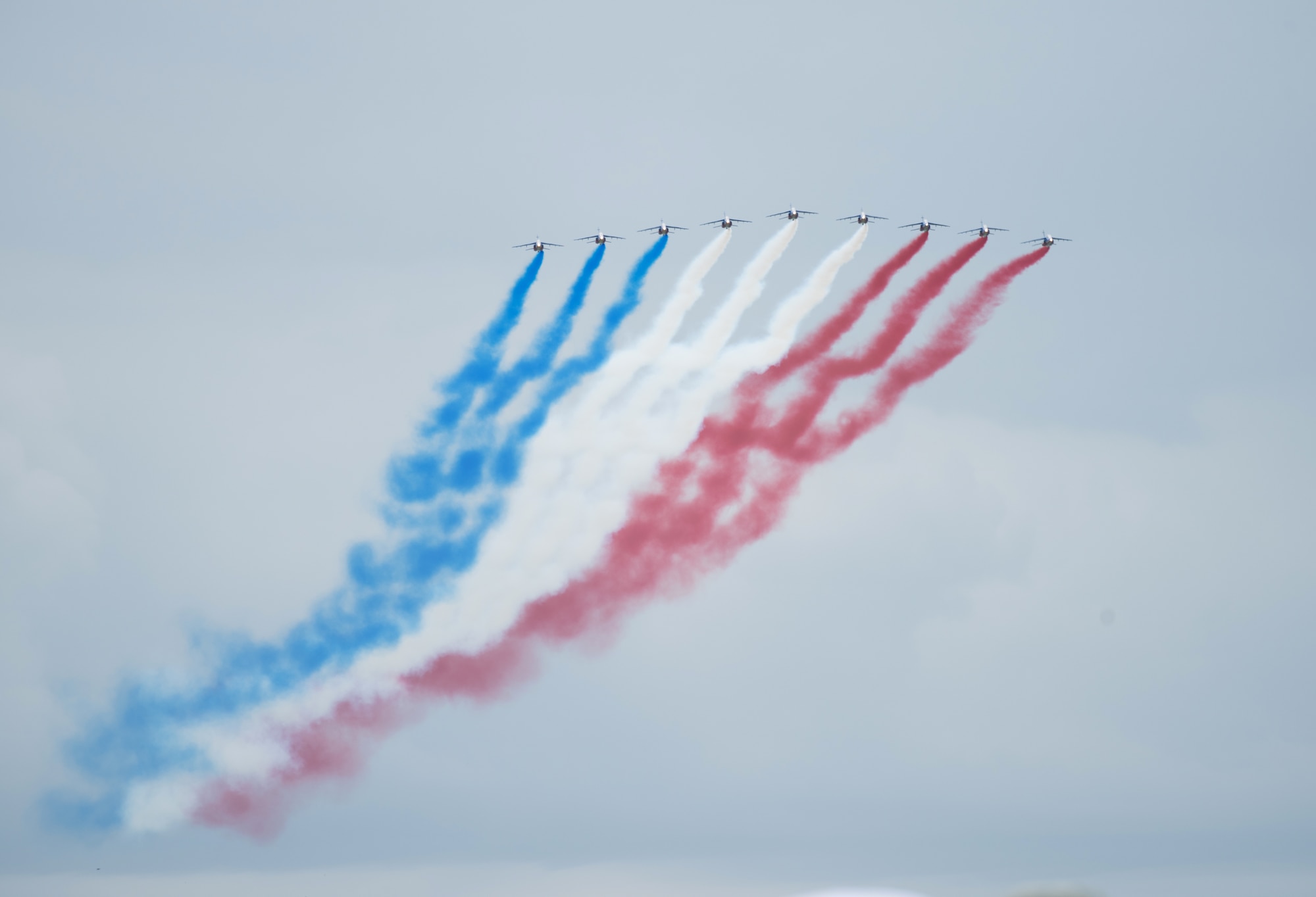 The French national aerobatic team, Patrouille Acrobatique de France, performs aerial demonstrations at the D-Day 75 Commemorative Airborne Operation in Sainte-Mere-Eglise, France, June 9, 2019, which honors the epic airborne operation conducted by Allied forces on June 6, 1944. This commemorative airborne operation was an opportunity for multinational forces to honor the past and simultaneously work to secure the future. Training together in the very same place that trans-Atlantic resolve began 75 years ago demonstrates the partnerships and bonds that we highly value and continue to benefit from to this day. (U.S. Air Force photo by Airman 1st Class Jennifer Zima)
