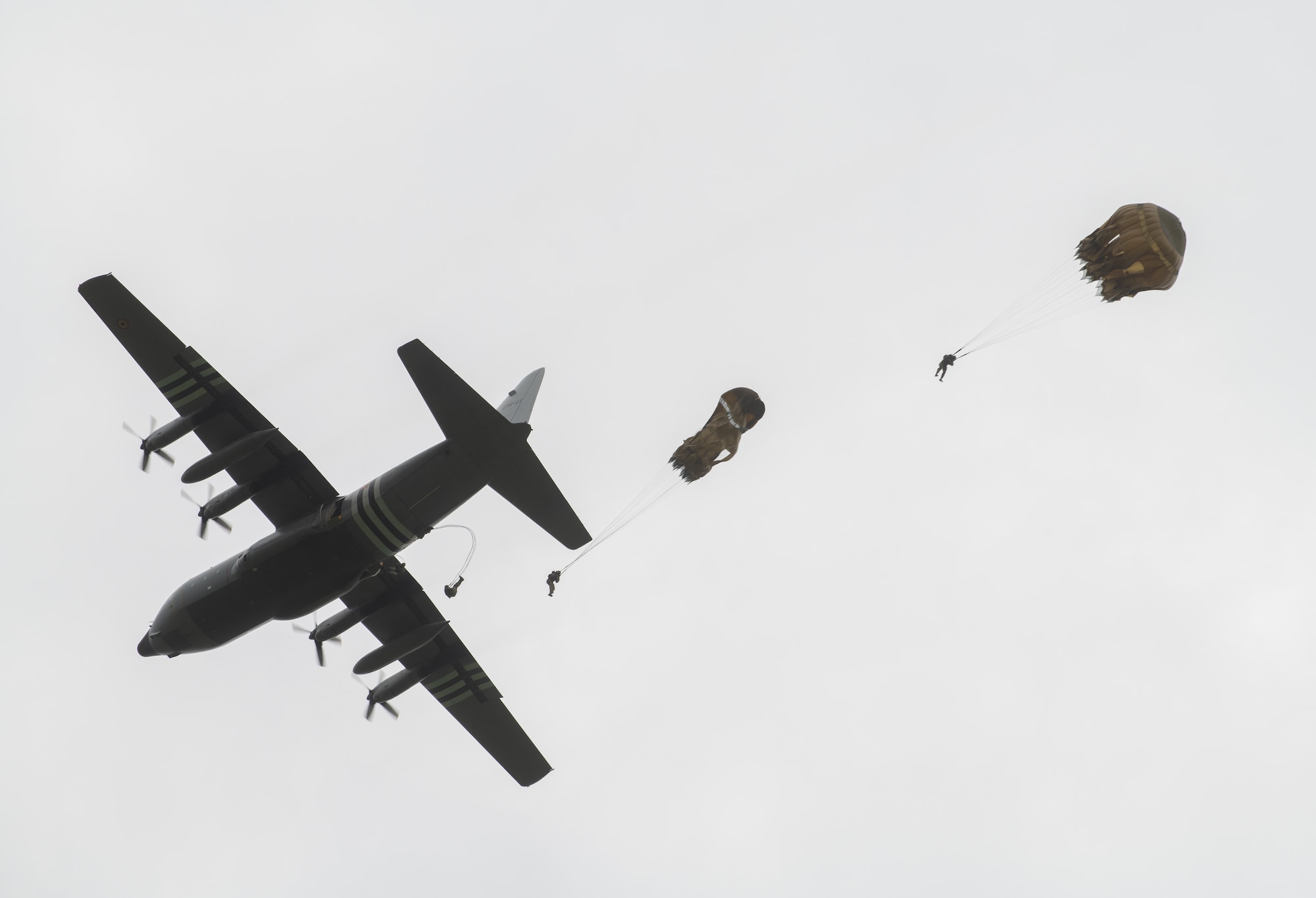 More than 1,100 parachutes sailed above Sainte-Mere-Eglise, France, to commemorate the 75th Anniversary of D-Day June 9, 2019. Nineteen aircraft from multiple nations and parachute jumpers from Belgium, France, Germany, the Netherlands, Romania, United Kingdom and the United States dropped civilians and Soldiers in front of thousands of spectators. (U.S. Air Force photo by Airman 1st Class Jennifer Zima)