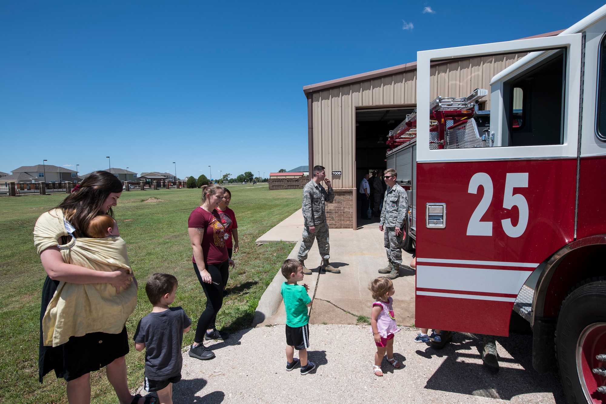 Cannon residents wait in line to see the inside of a fire engine at the new fire station at Cannon Air Force Base, N.M., June 6, 2019. The fire station, officially opened June 1, was constructed to provide a location for Cannon’s firefighters closer to Chavez housing and respond to calls within their short time limit. (U.S. Air Force Photo by Airman 1st Class Vernon R. Walter III)