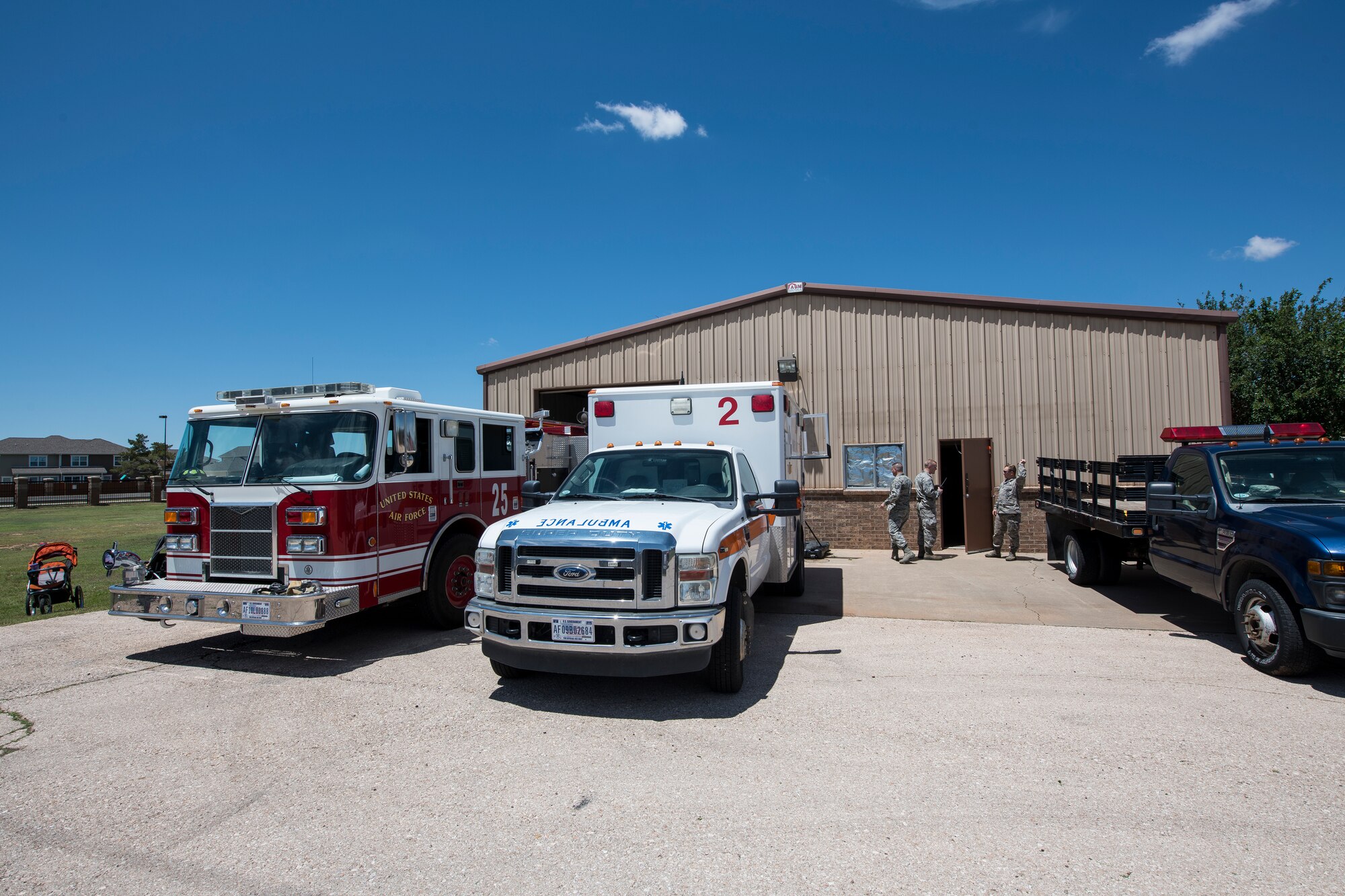 Air Commandos take a break after giving tours of the new fire station to members of base housing at Cannon Air Force Base, N.M., June 6, 2019. Firefighters have seven minutes to respond to a structural fire and the new station gives them the ability to arrive at any location in Chavez in less. (U.S. Air Force Photo by Airman 1st Class Vernon R. Walter III)
