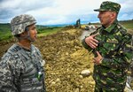 Second Lt. Vincent Owyong, of the 240th Engineer Company based in Las Vegas, Nevada, speaks with a soldier from the Romanian Land Forces (who chooses to be unnamed) during a construction project in Cincu, Romania, May 31st, 2019. The project is part of exercise Resolute Castle 2019, a multi-national joint exercise with real-world outputs of completed construction projects that build and enhance training capabilities around Eastern Europe.