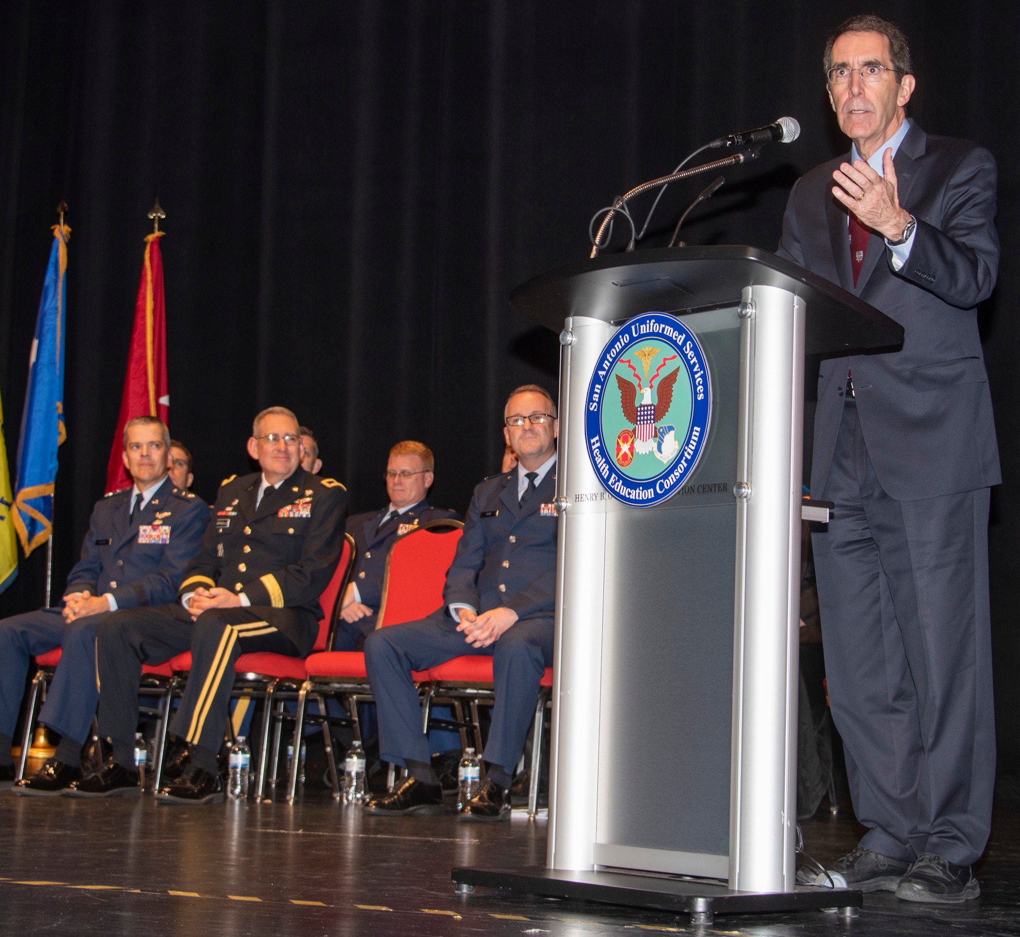 Dr. Arthur L. Kellermann, dean of the F. Edward Hebert School of Medicine, Uniformed Services University, speaks during the San Antonio Uniformed Services Health Education Consortium graduation ceremony at the Lila Cockrell Theatre in downtown San Antonio June 7. The ceremony honored 228 Army, Air Force, Navy, Public Health and civilian medical education and allied health graduates.