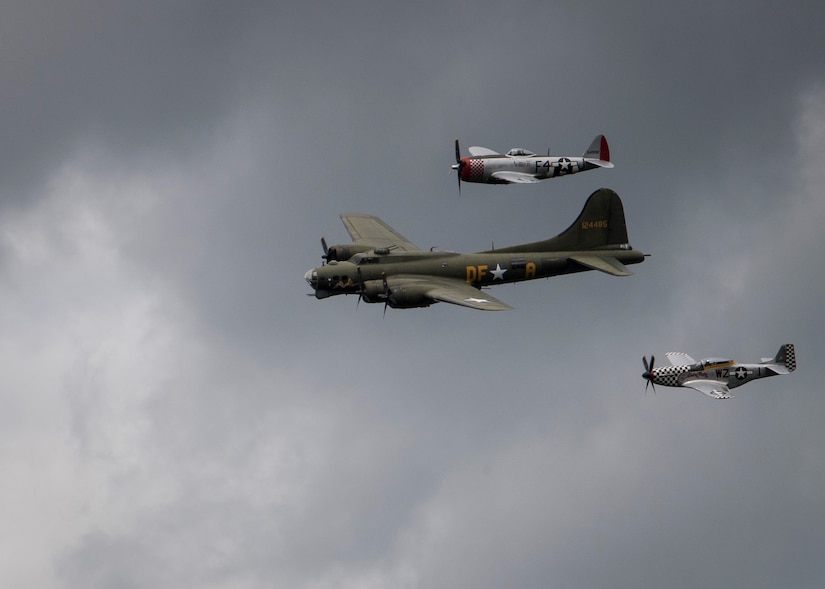 A B-17 Flying Fortress is accompanied by a P-47 Thunderbolt and Spitfire while conducting a fly-over above the Cambridge and Madingley American Cemetery during a Memorial Day event in Cambridge, England, May 27, 2019. The B-17, which was a staple of the skies during World War II, was flown by the 305th Bomb Group which has now become the 305th Air Mobility Wing at Joint Base McGuire-Dix-Lakehurst, New Jersey. (U.S. Air Force photo by Senior Airman Jake Carter)