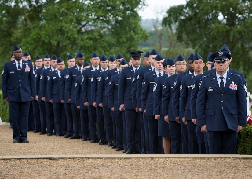: Airmen from RAF Lakenheath and Mildenhall stand-by during a Memorial Day event at the Cambridge and Madingley American Cemetery in Cambridge, England, May 27, 2019. Airmen were able to partake in a wreath laying ceremony that honored fallen military personnel during World War II and D-Day with its 75th anniversary on June 6. (U.S. Air Force photo by Senior Airman Jake Carter)