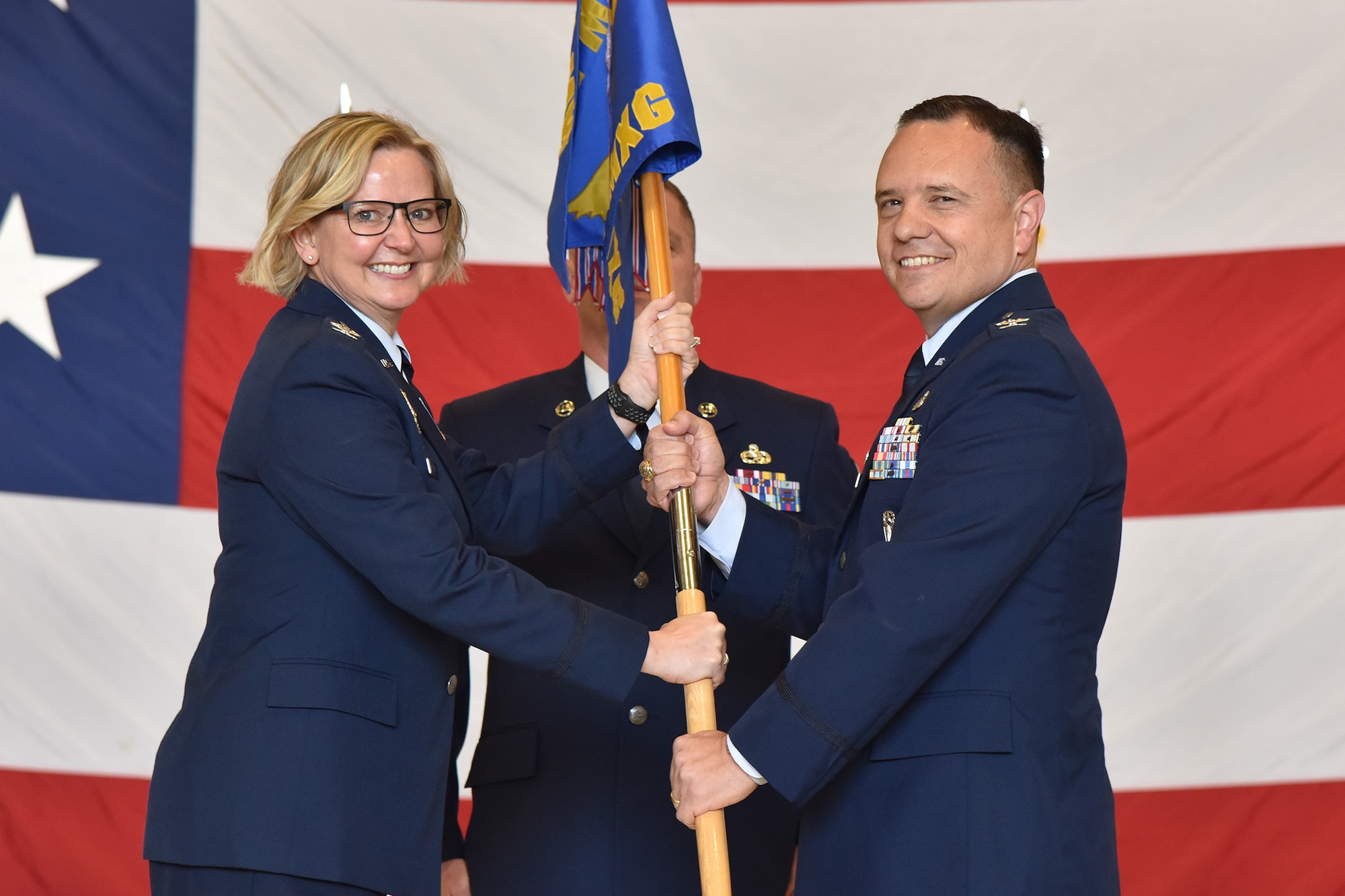 Col. Nathan Mitchell, right, accepts command of the 341st Maintenance Group from Col. Jennifer Reeves, 341st Missile Wing commander, during a change of command ceremony June 12, 2019, at Malmstrom Air Force Base, Mont.