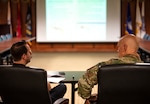 Maj. Gen. James O. Eifert, Florida's adjutant general, meets with Division of Emergency Management Director Jared Moskowitz, left, at Camp Blanding Joint Training Center's post headquarters to discuss the Florida National Guard's natural disaster response capabilities.