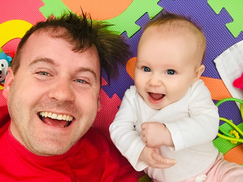 U.S. Air Force Technical Sgt. Carlin Leslie, 633rd Air Base Wing Public Affairs photojournalist and his daughter Lacey play on the floor at their home June 12, 2019. (courtesy photo)