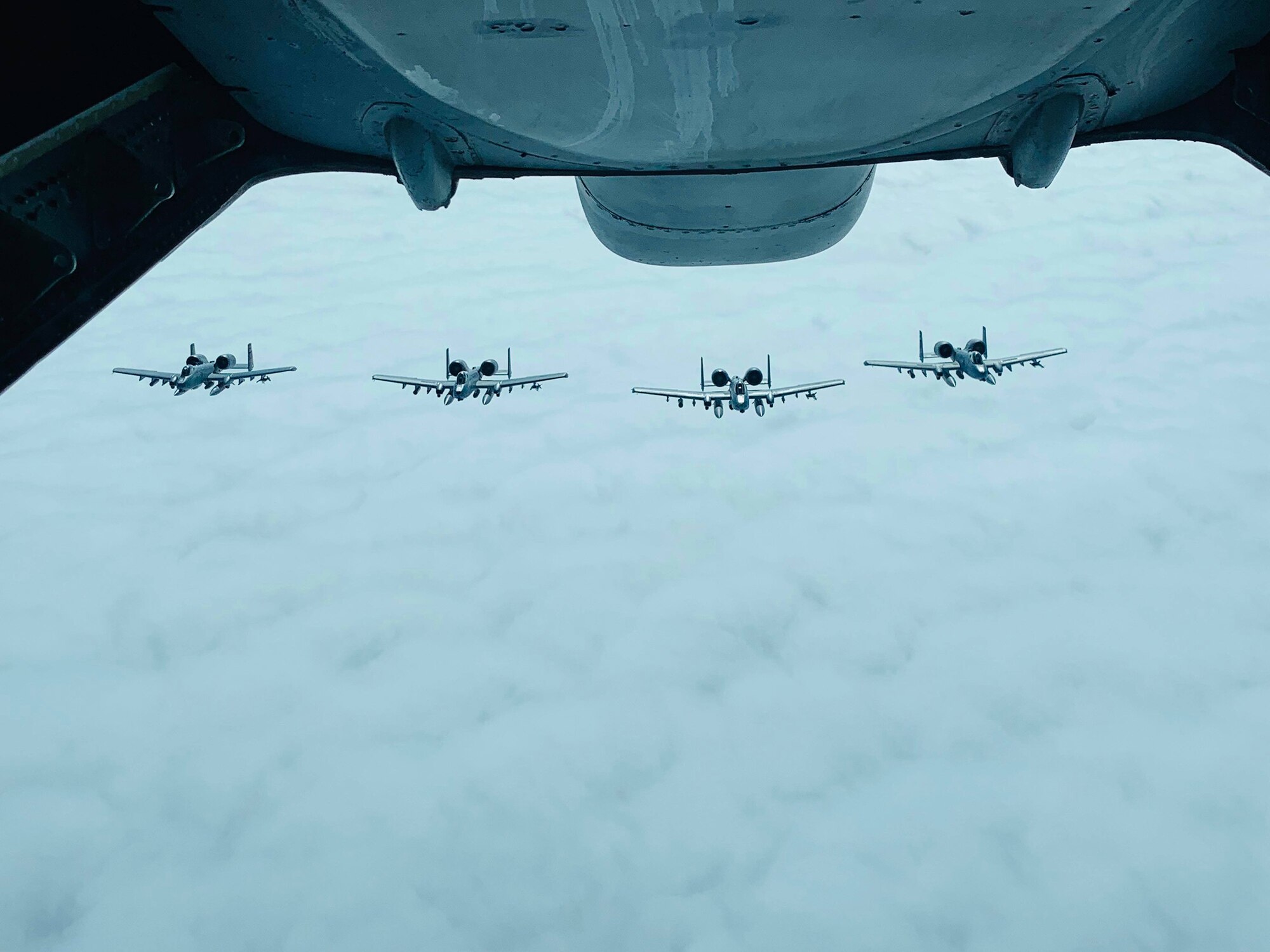 U.S. Air Force KC-10 Extender from Travis Air Force Base, California, flies above A-10 Thunderbolt aircraft over the Pacific Ocean. The Thunderbolts were on their way to participate in Red Flag-Alaska 19-2, a large-scale exercise headquartered at Eielson Air Force Base, Alaska. The exercise began June 6 and is scheduled to continue through June 21. (U.S. Air Force courtesy photo)