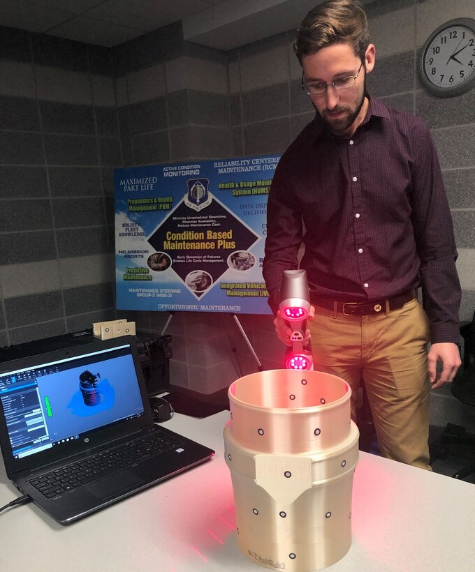 Premier College intern Matthew Robinson, a mechanical engineering student at Cedarville University, learns how to create a 3D model of an airplane part using scanning software at the University of Dayton Research Institute. He is interning with the Air Force Life Cycle Management Center at Wright-Patterson Air Force Base, Ohio. (Contributed U.S. Air Force photo)