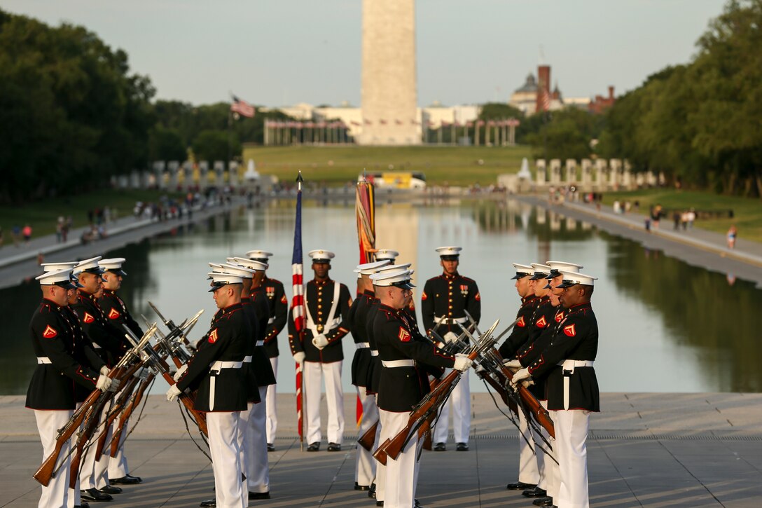 Marines with the Silent Drill Platoon perform during a Tuesday Sunset Parade at the Lincoln Memorial, Washington, D.C., June 11, 2019. The guest of honor for the evening was William P. Barr, attorney general, and the hosting official was Mr. Robert Hogue, counsel for the commandant of the Marine Corps. (U.S. Marine Corps photo by Pfc. Allen Sanders)