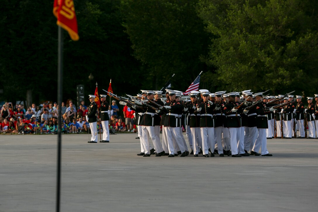 Marines with the Silent Drill Platoon perform their “bursting bomb” sequence during a Tuesday Sunset Parade at the Lincoln Memorial, Washington, D.C., June 11, 2019. The guest of honor for the evening was William P. Barr, attorney general, and the hosting official was Mr. Robert Hogue, counsel for the commandant of the Marine Corps. (U.S. Marine Corps photo by Pfc. Allen Sanders)