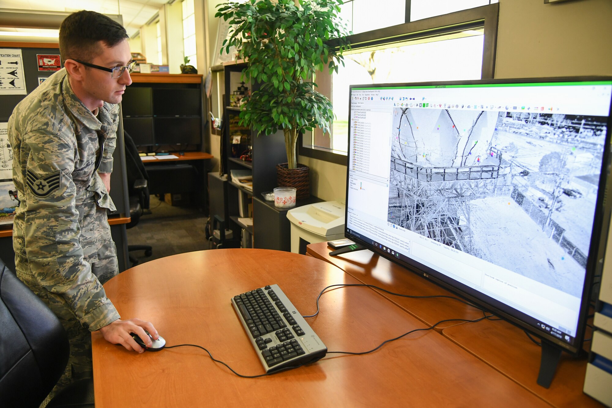 Staff Sgt. Austin Marshall, 84th Radar Evaluation Squadron, shows a scan from a 3-D terrestrial laser scanner April 17, 2019, at Hill Air Force Base, Utah. The survey section of the squadron recently received the new laser that provides faster and more accurate surveys around radar sites. (U.S. Air Force photo by Cynthia Griggs)