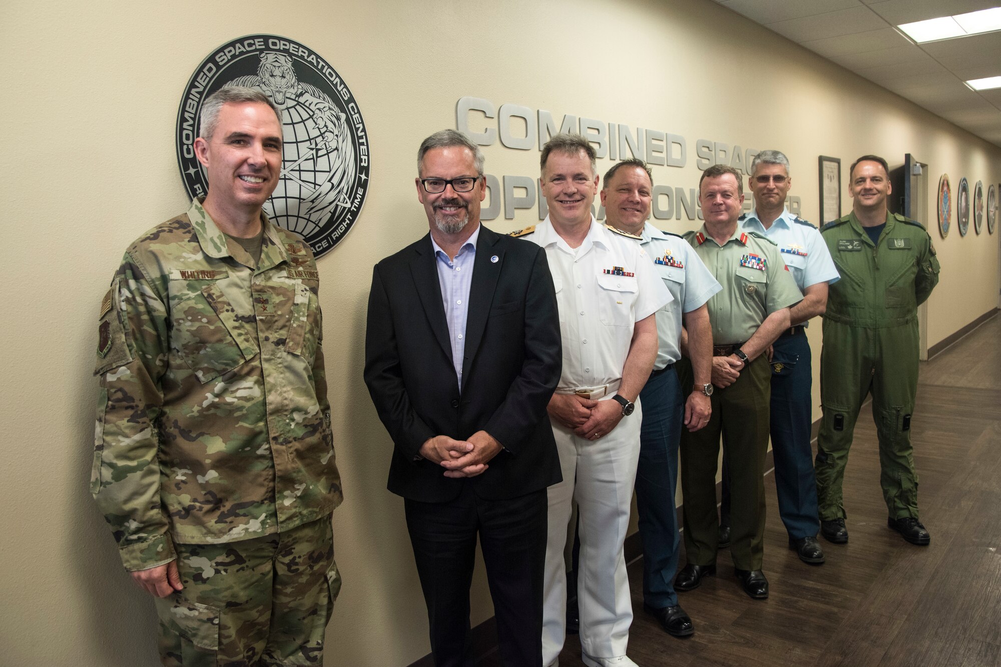 Sylvain Laporte, Canadian Space Agency president, poses for a photo in the Combined Space Operations Center during a tour June 12, 2019 at Vandenberg Air Force Base, Calif. During his visit, Laporte toured the CSpOC and learned how members of the CSpOC and 18th Space Control Squadron assist the U.S. Air Force Space Command mission. (U.S. Air Force photo by Airman 1st Class Aubree Milks)