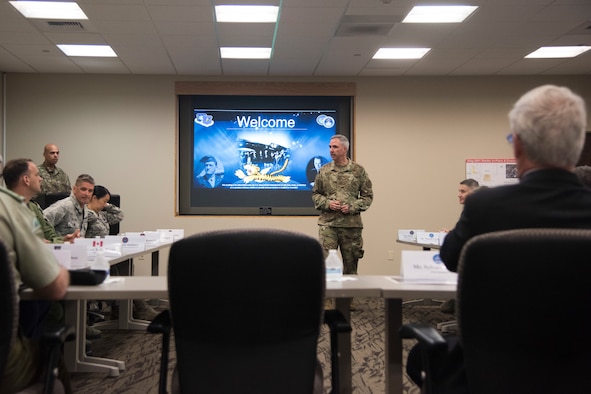 Maj. Gen. Stephen Whiting, 14th Air Force commander, briefs Sylvain Laporte, Canadian Space Agency president, during a tour June 12, 2019, at Vandenberg Air Force Base, Calif. During his visit, Laporte toured the CSpOC and learned how members of the CSpOC and 18th Space Control Squadron assist the U.S. Air Force Space Command mission. (U.S. Air Force photo by Airman 1st Class Aubree Milks)
