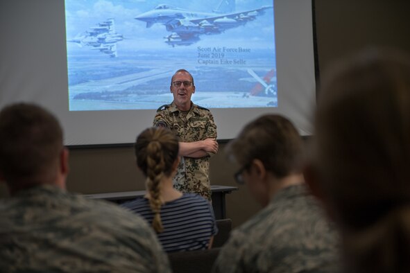 Capt. Eike Selle, officer in the German Reserve Luftwaffe (Air Force) visiting the 932nd Airlift Wing since June 1st, poses with the group of Airmen from the 932nd AW following his briefing about the German Reserve Air Force, June 12, 2019, Scott Air Force Base, Illinois. (U.S. Air Force photo by Christopher Parr)