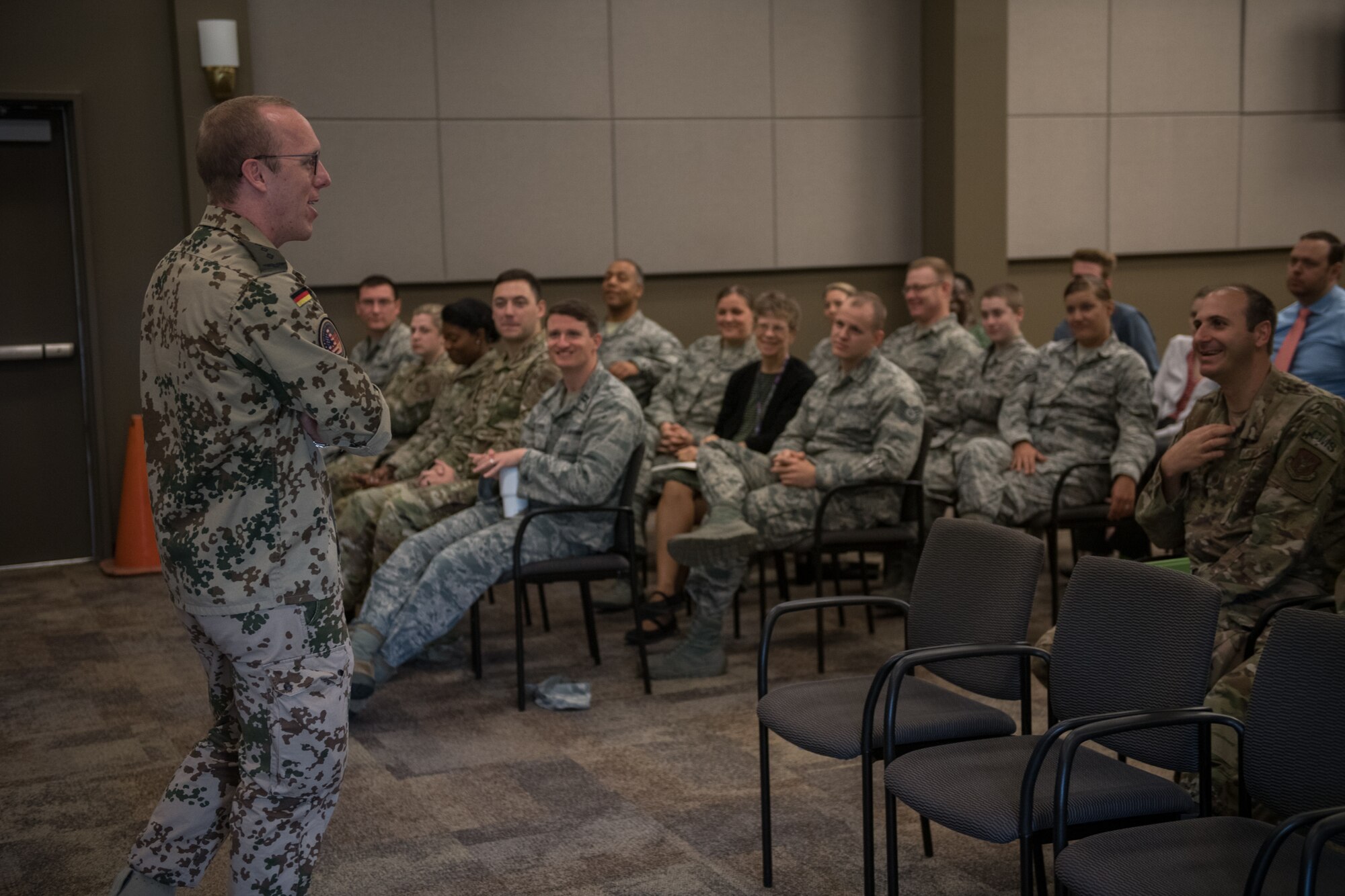 Capt. Eike Selle, German national in the German Reserve Luftwaffe (Air Force) visiting the 932nd Airlift Wing since June 1st, gives an overview of the German Reserves and some comparisons between Germany and United States to a group of Airmen from the 932nd AW,  June 12, 2019, Scott Air Force Base, Illinois. (U.S. Air Force photo by Christopher Parr)