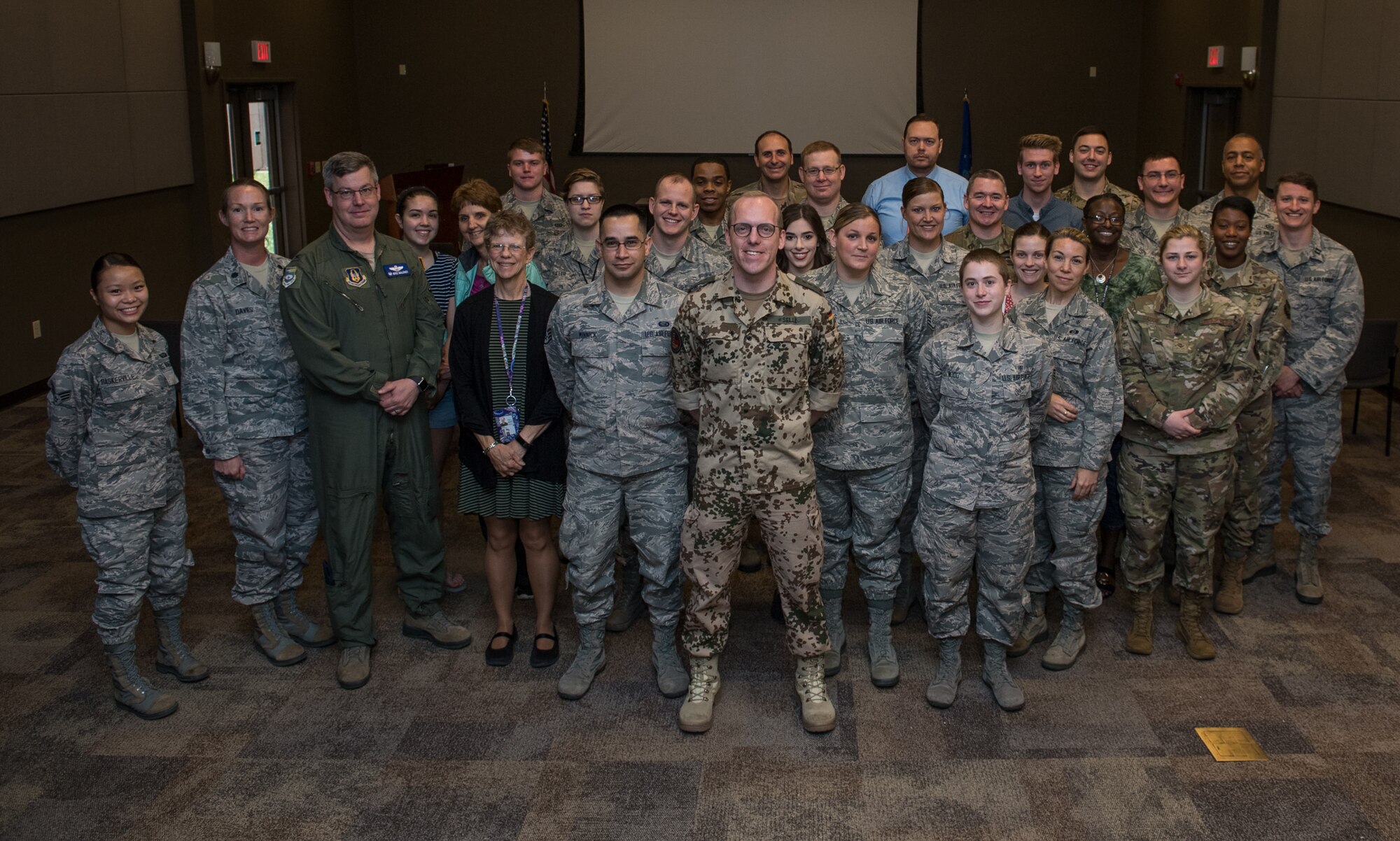 Capt. Eike Selle, officer in the German Reserve Luftwaffe (Air Force) visiting the 932nd Airlift Wing since June 1st, poses with the group of Airmen from the 932nd AW following his briefing about the German Reserve Air Force, June 12, 2019, Scott Air Force Base, Illinois. (U.S. Air Force photo by Christopher Parr)