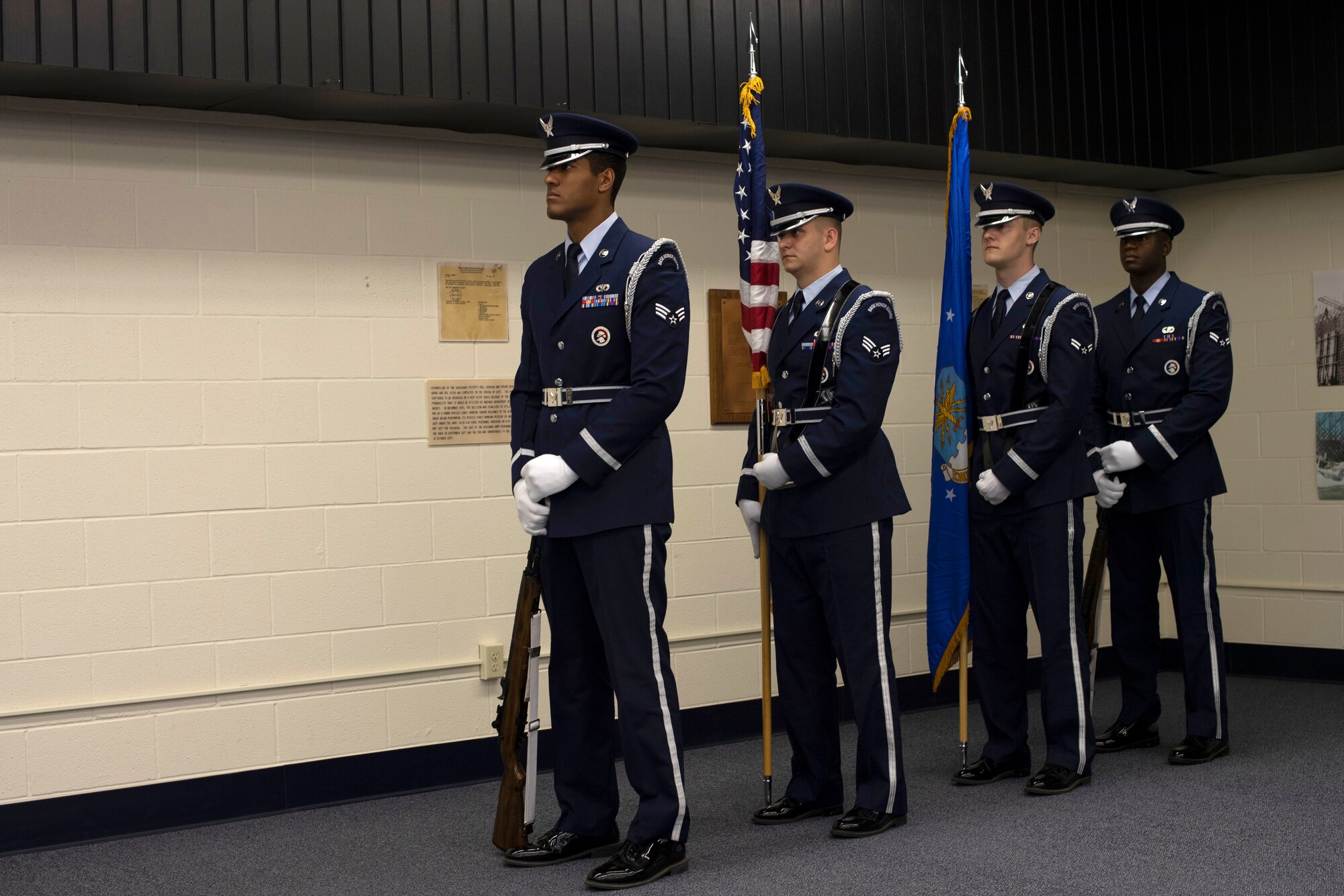 The 319th Air Base Wing Honor Guard stands in wait prior to a change of command ceremony June 11, 2019, on Cavalier Air Force Station, North Dakota. The change of command ceremony took place to say goodbye to outgoing commander, Lt. Col. Stephen Hobbs, and hello to incoming commander, Lt. Col. Ryan Durand, of the 10th Space Warning Squadron. (U.S Air Force photo by Senior Airman Elora J. Martinez)