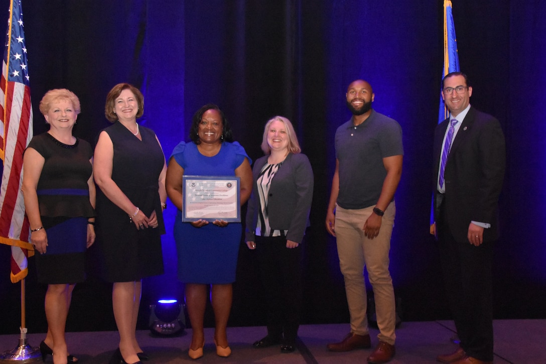 Forsyth Technical Community College located in Winston-Salem, N.C., was among the schools recognized at CAE’s designation ceremony held June 11, 2019. Pictured from left to right: NSA State & Local Affairs Director Judith Emmel; Forsyth Tech President Dr. Janet Spriggs; Dr. Deanne Wesley, Forsyth Tech Associate Dean Thomas Davis iTEC Cybersecurity Center; Pamela Short, Forsyth Tech Dean, Business and Information Technology; James Brown, Forsyth Tech Program Coordinator, IT System Security/Cyber; and Dan Stein DHS Branch Chief for Cybersecurity Education and Awareness, Cybersecurity and Infrastructure Security Agency (CISA).