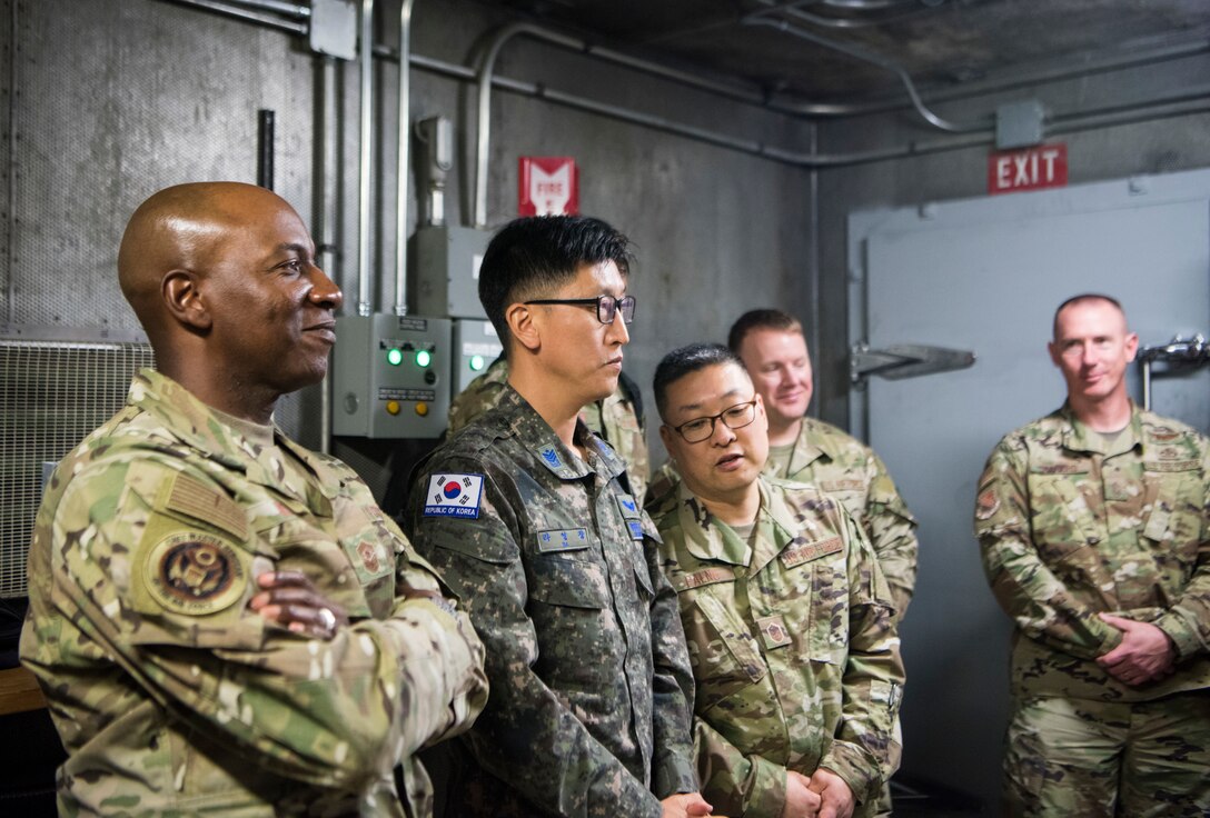 Chief Master Sergeant of the Air Force Kaleth O. Wright, chief master sergeant of the Republic of Korea, Ra Young-Chang and Joint Base Elmendorf-Richardson senior enlisted leaders are briefed before an F-22 jet engine test cell function check at JBER, Alaska, June 10, 2019. Chief Wright visited JBER during Red Flag-Alaska 19-2 to meet with his senior enlisted leader counterparts from throughout the Pacific. Red Flag-Alaska is a Pacific Air Forces-directed exercise that allows U.S. forces to train with coalition partners in a simulated combat environment.