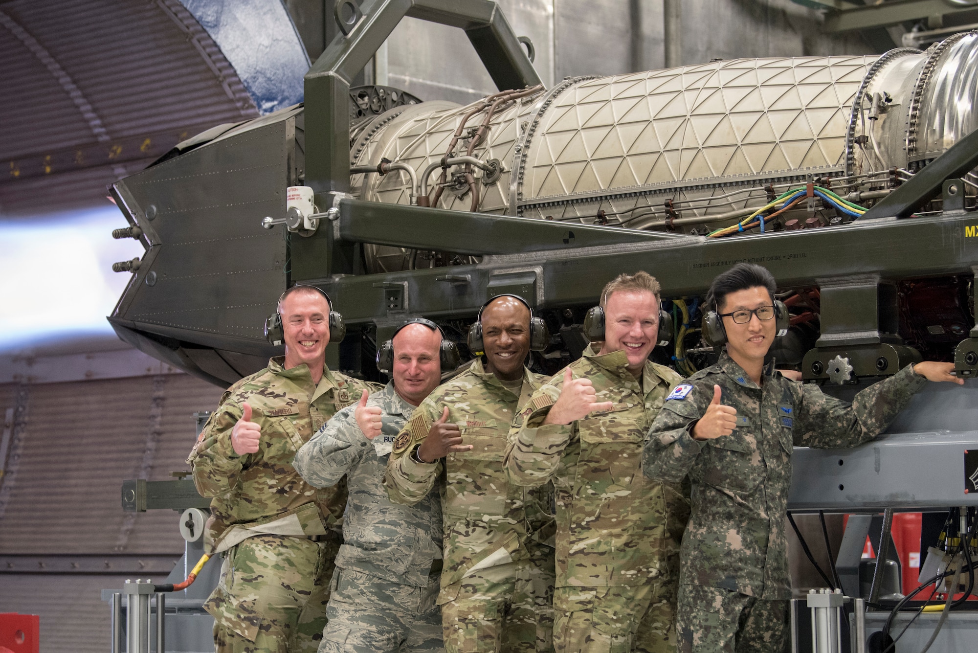 Chief Master Sergeant of the Air Force Kaleth O. Wright, chief master sergeant of the Republic of Korea Young Chan Ra and Joint Base Elmendorf-Richardson senior enlisted leaders pose for a photo during an F-22 jet engine test cell function check at JBER, Alaska, June 10, 2019. Chief Wright visited JBER during Red Flag-Alaska 19-2 to meet with his senior enlisted leader counterparts from throughout the Pacific. Red Flag-Alaska is a Pacific Air Forces-directed exercise that allows U.S. forces to train with coalition partners in a simulated combat environment.