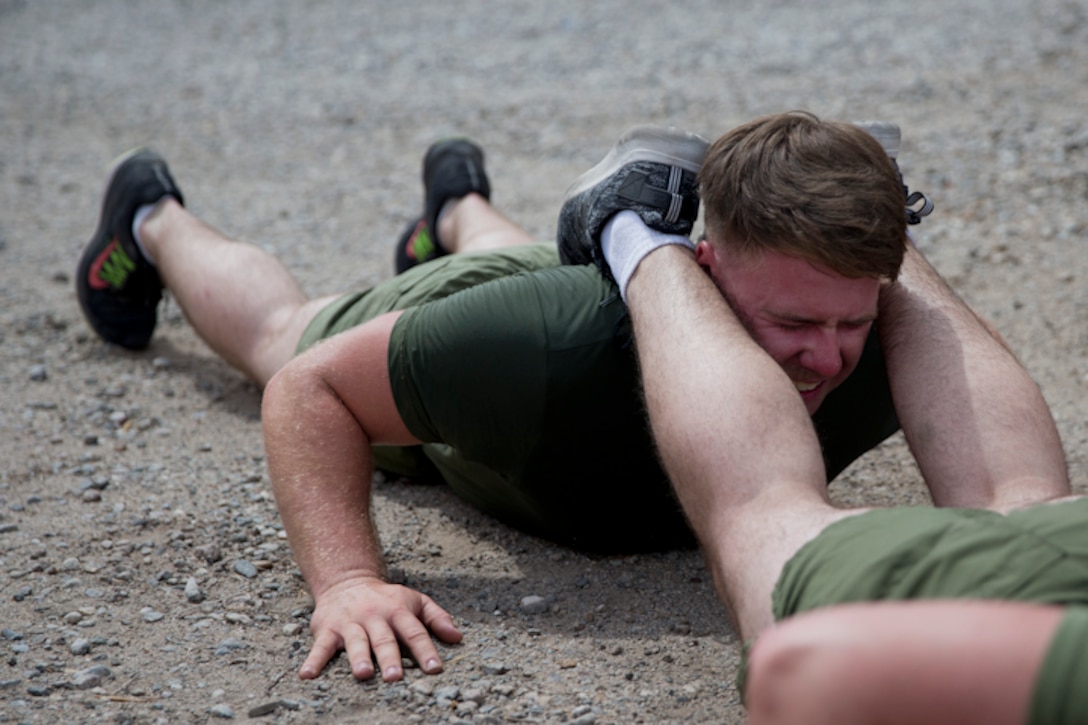 U.S. Marines with Communications Squadron 28, Marine Corps Air Station Cherry Point conduct physical training at Marine Corps Air Station Yuma Ariz., May 2, 2019. U.S. Marines stay in shape by training their bodies and minds during vigorous physical activities to ensure combat readiness at all times. (U.S. Marine Corps photo by Lance Cpl. Joel Soriano)