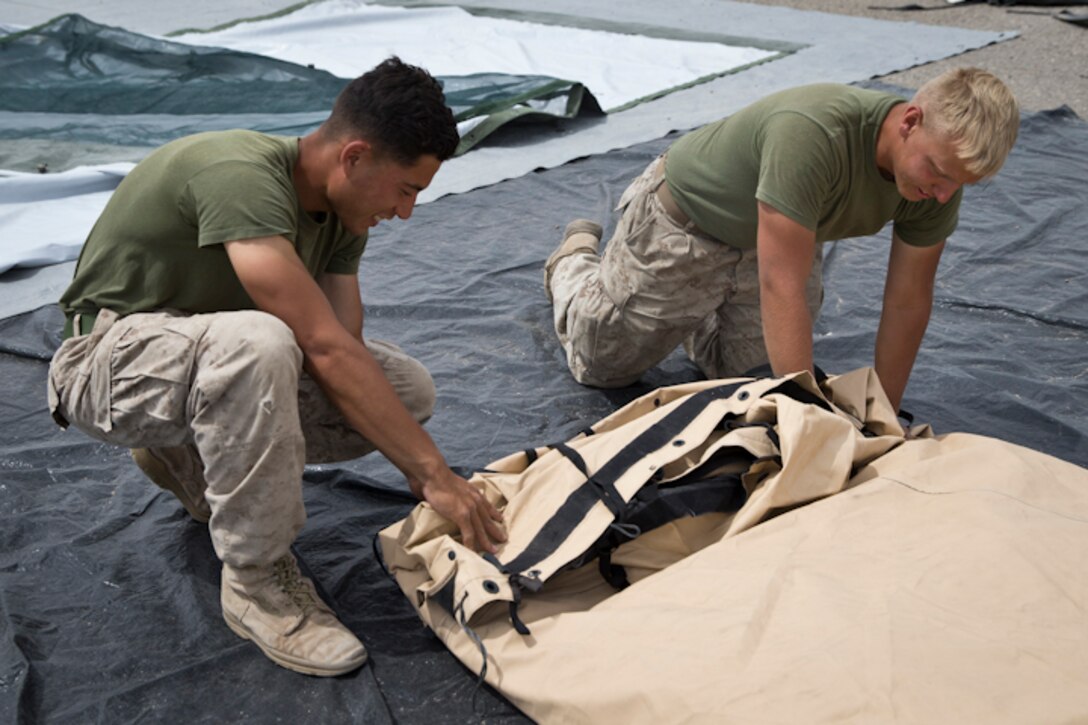 U.S. Marines assigned to Marine Wing Support Squadron 274 clean and return their gear to the Individual Issue Facility at the end of Weapons and Tactics Instructor (WTI) course 2-19 on Marine Corps Air Station Yuma Ariz., May 2, 2019. WTI is a seven-week training event hosted by Marine Aviation Weapons and Tactics Squadron One, which emphasizes operational integration of the six functions of Marine Corps aviation in support of a Marine Air Ground Task Force. WTI also provides standardized advanced tactical training and certification of unit instructor qualifications to support Marine aviation training and readiness, and assists in developing and employing aviation weapons and tactics. (U.S. Marine Corps photo by Lance Cpl. Joel Soriano)