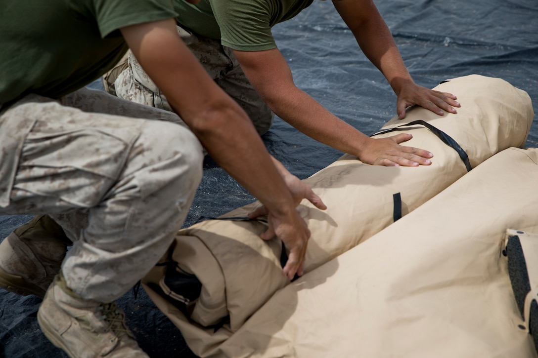 U.S. Marines assigned to Marine Wing Support Squadron 274 clean and return their gear to the Individual Issue Facility at the end of Weapons and Tactics Instructor (WTI) course 2-19 on Marine Corps Air Station Yuma Ariz., May 2, 2019. WTI is a seven-week training event hosted by Marine Aviation Weapons and Tactics Squadron One, which emphasizes operational integration of the six functions of Marine Corps aviation in support of a Marine Air Ground Task Force. WTI also provides standardized advanced tactical training and certification of unit instructor qualifications to support Marine aviation training and readiness, and assists in developing and employing aviation weapons and tactics. (U.S. Marine Corps photo by Lance Cpl. Joel Soriano)