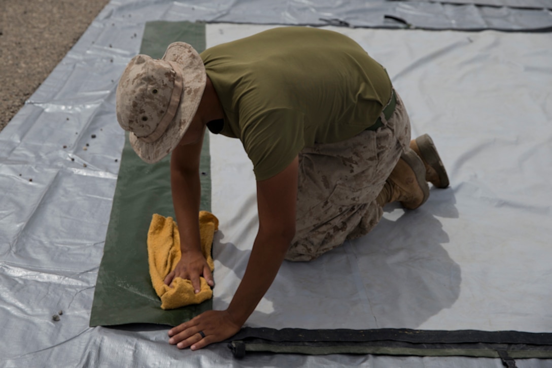 U.S. Marines assigned to Marine Wing Support Squadron 274 clean and return their gear to the Individual Issue Facility at the end of Weapons and Tactics Instructor (WTI) course 2-19 on Marine Corps Air Station Yuma Ariz., May 2, 2019. WTI is a seven-week training event hosted by Marine Aviation Weapons and Tactics Squadron One, which emphasizes operational integration of the six functions of Marine Corps aviation in support of a Marine Air Ground Task Force. WTI also provides standardized advanced tactical training and certification of unit instructor qualifications to support Marine aviation training and readiness, and assists in developing and employing aviation weapons and tactics. (U.S. Marine Corps photo by Lance Cpl. Joel Soriano)