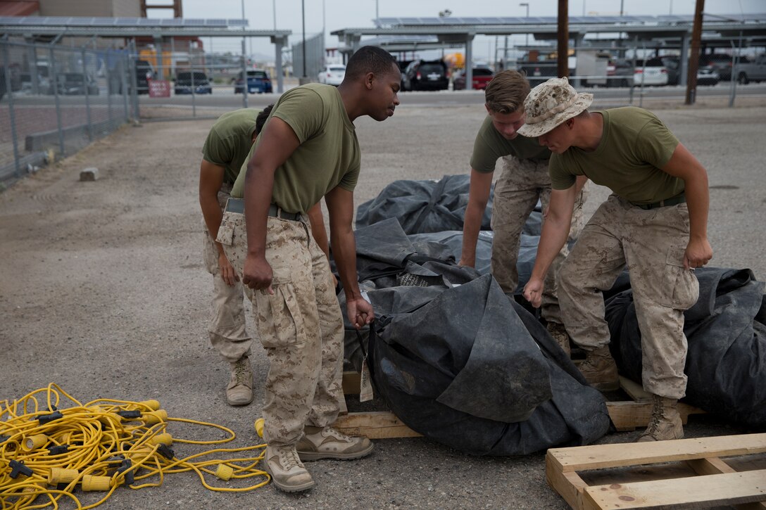 U.S. Marines assigned to Marine Wing Support Squadron 274 clean and return their gear to the Individual Issue Facility at the end of Weapons and Tactics Instructor (WTI) course 2-19 on Marine Corps Air Station Yuma Ariz., May 2, 2019. WTI is a seven-week training event hosted by Marine Aviation Weapons and Tactics Squadron One, which emphasizes operational integration of the six functions of Marine Corps aviation in support of a Marine Air Ground Task Force. WTI also provides standardized advanced tactical training and certification of unit instructor qualifications to support Marine aviation training and readiness, and assists in developing and employing aviation weapons and tactics. (U.S. Marine Corps photo by Lance Cpl. Joel Soriano)