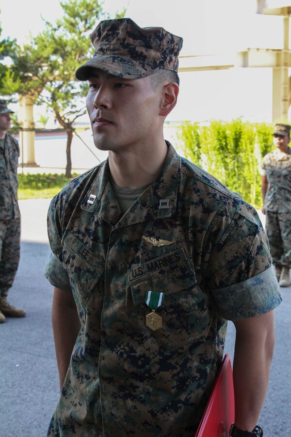 CAMP HUMPHREYS, Republic of Korea – Capt. Eric Lee, U.S. Marine Corps Forces Korea 7th Air Force liaison officer, received the Navy and Marine Corps Commendation Medal during an awards ceremony here, June 13. Lee was awarded for his excellence in coordinating between 7th Air Force and MARFORK, as well as strengthening the relationships between services. (Official U.S. Marine Corps photo by Sgt. Nathaniel Hanscom/Released)