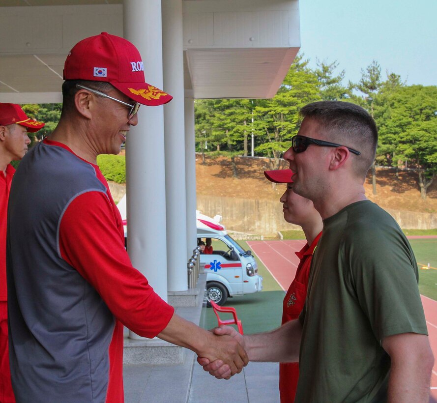 BARAN, Republic of Korea – U.S. and Republic of Korea Marines gather to partake in a field meet involving multiple games and competitions and ending with an awards and recognition ceremony here, June 12. The Marines competed in soccer, foot volleyball, a three legged race, and a 1200 meter relay race as part of an event to enhance the ROK-U.S. Alliance and strengthen the relationship between the two countries’ Marine Forces. (Official U.S. Marine Corps photos by Sgt. Nathaniel Hanscom/Released)