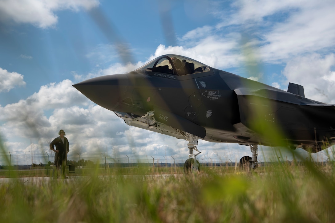 U.S. Air Force Capt. Russell Lee, 421st Fighter Squadron pilot, left, and Tech. Sgt. Adam Hudson, 421st Aircraft Maintenance Unit crew chief, right, prepare to de-arm an F-35A Lightning II fighter aircraft, assigned to the 421st FS from Hill Air Force Base, Utah, on the flightline at Spangdahlem Air Base, Germany, June 11, 2019. Multiple F-35s came to the European theater as part of a Theater Security Package. These 5th generation aircraft enable the increase of readiness and responsiveness of U.S. forces in Europe to support the defense and security of NATO allies. (U.S. Air Force photo by Airman 1st Class Valerie Seelye)
