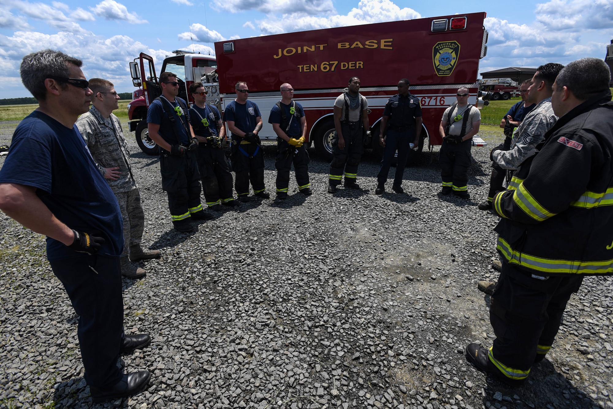 An 87th Civil Engineer Squadron fire department team review the fire training conducted on Joint Base McGuire-Dix-Lakehurst, New Jersey, June 3, 2019. The training is reviewed to recognize what was executed properly, what might have been done wrong and what can be improved. (U.S. Air Force photo by Airman 1st Class Ariel Owings)