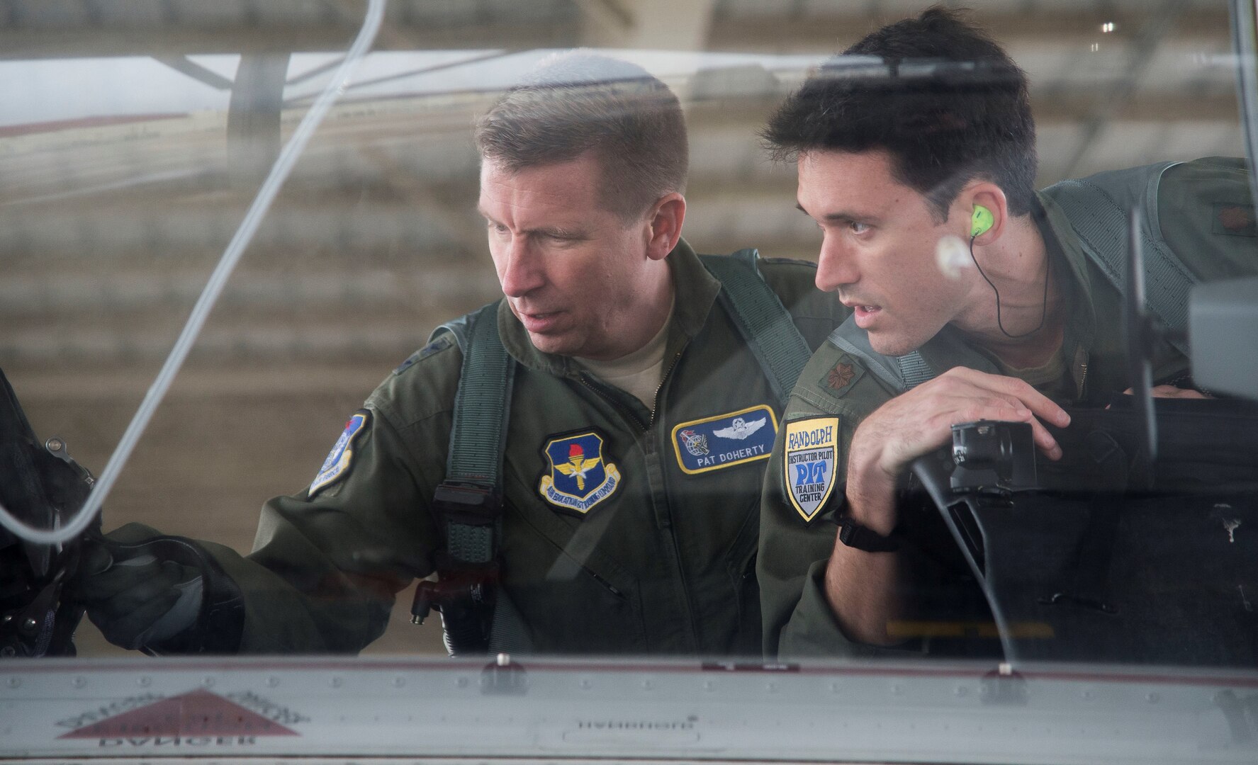 Maj. Gen. Patrick Doherty (left), 19th Air Force commander, and Maj. Lincoln Olsen, T-6 Texan II instructor pilot, conduct a T-6 Texan II safety check before conducting an operational demonstration at Joint Base San Antonio-Randolph Feb. 21, 2018. Doherty was on the flightline getting test data first-hand during the command-wide T-6 operational pause.