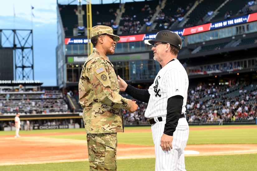 Master Sgt. Shandrel Daniels meets Chicago White Sox third base coach, Nick Capra, during the White Sox vs Washington Nationals game at Guaranteed Rate Field, June 11, 2019.