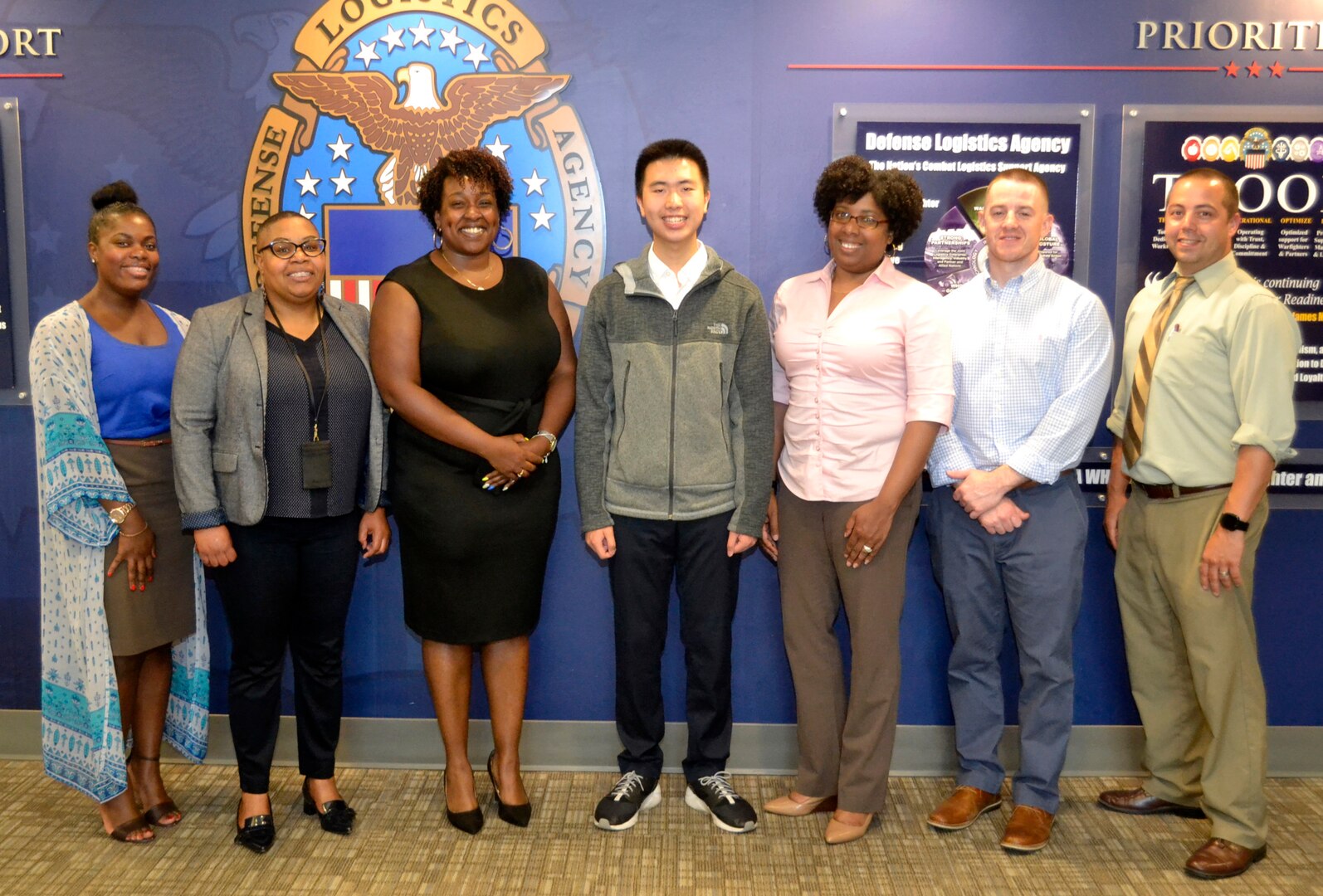 Ning Cao, a former DLA Troop Support intern, center, poses with members of the DLA Troop Support Corporate Communications office and the Philadelphia School District at DLA Troop Support June 5, 2019 in Philadelphia.