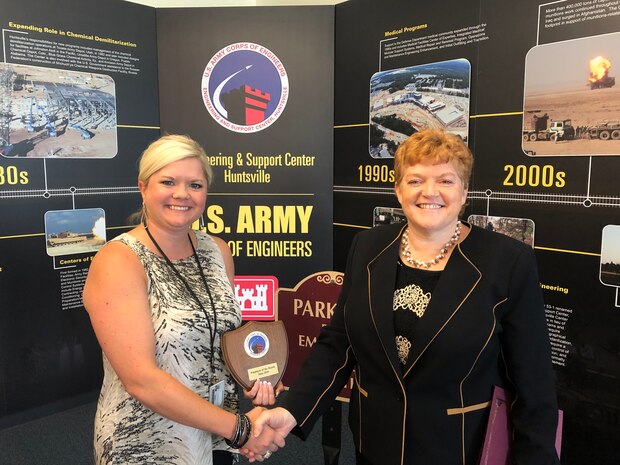 Acquisition Support Specialist Bonnie Patterson (left) receives a certificate recognizing her award as the Huntsville Center Employee of the Month for June from Colleen O’Keefe (right), Center contracting chief. Patterson is a 17-year employee at the Center and was chosen for her tireless efforts in supporting three different energy programs as well as her many other contributions.