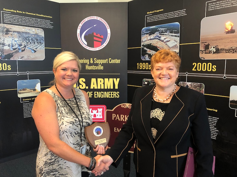 Acquisition Support Specialist Bonnie Patterson (left) receives a certificate recognizing her award as the Huntsville Center Employee of the Month for June from Colleen O’Keefe (right), Center contracting chief. Patterson is a 17-year employee at the Center and was chosen for her tireless efforts in supporting three different energy programs as well as her many other contributions.