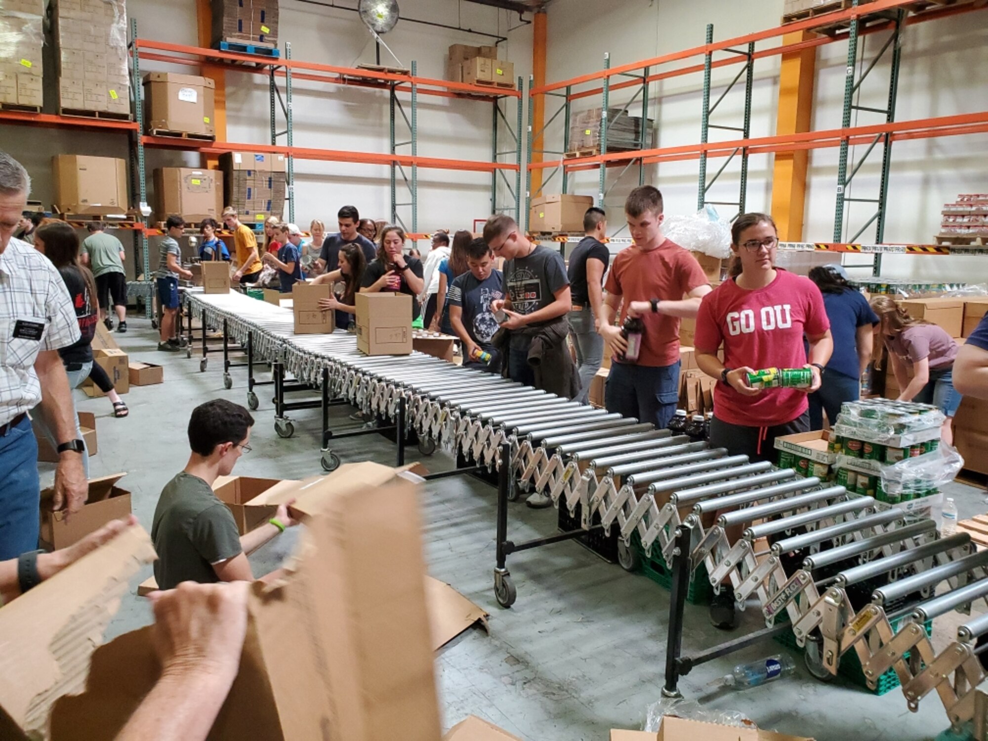 Airmen assigned to the 56th Fighter Wing volunteer at St. Mary’s Food Bank Alliance, packing emergency food boxes, June 8, 2019, in Phoenix.