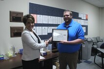 A Naval Surface Warfare Center, Crane Division (NSWC Crane) Branch Manager was recognized for supporting an employee currently serving in the National Guard. Logan Corbett received the Employer Support of the Guard and Reserve (ESGR) Patriot Award, which acknowledges efforts to provide flexible schedules, time off prior to and after deployment, caring for families, and granting leaves of absences if needed.