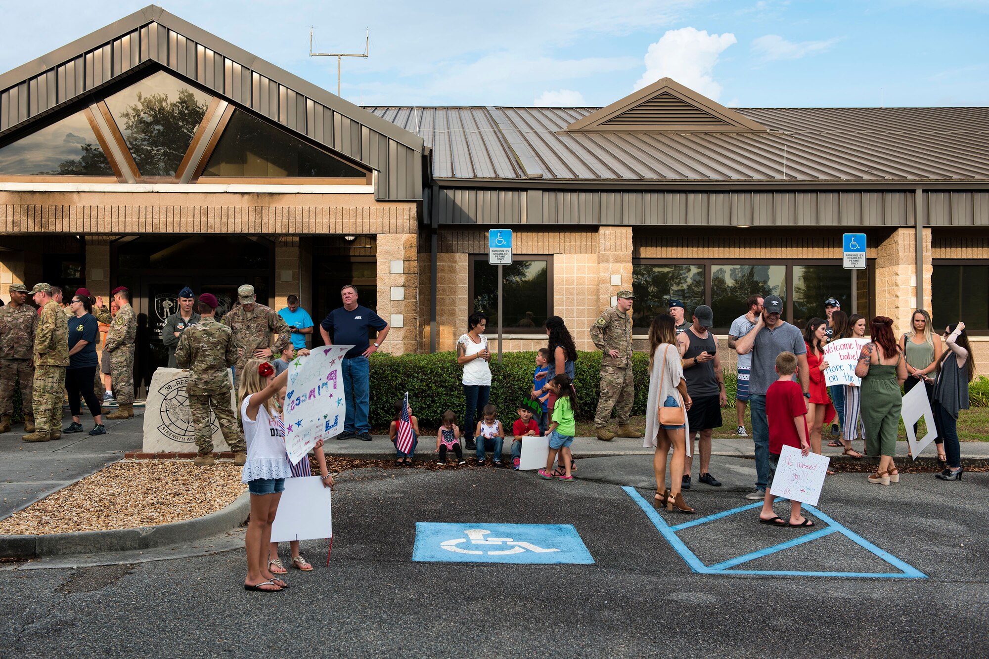 Members from Team Moody await the return of Airmen from the 38th Rescue Squadron (RQS) during a redeployment, June 10, 2019, at Moody Air Force Base, Ga. Personnel from the 38th RQS deployed as part of Combined Joint Task Force-Horn of Africa where they provided robust personnel recovery capabilities to support the security objectives of United States Africa Command and United States European Command. (U.S. Air Force photo by Senior Airman Erick Requadt)